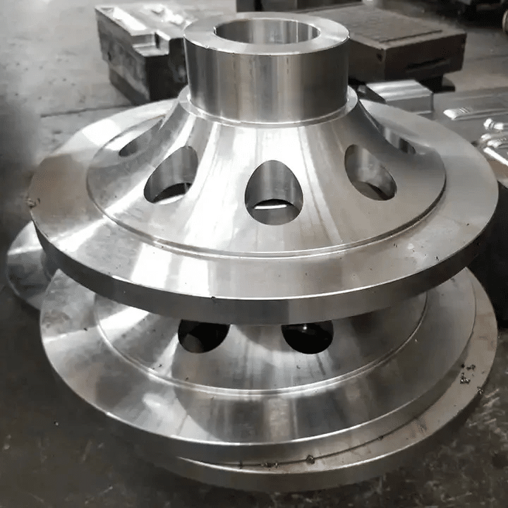 precision CNC machined die cast component with central bore used as primary datum for concentricity control