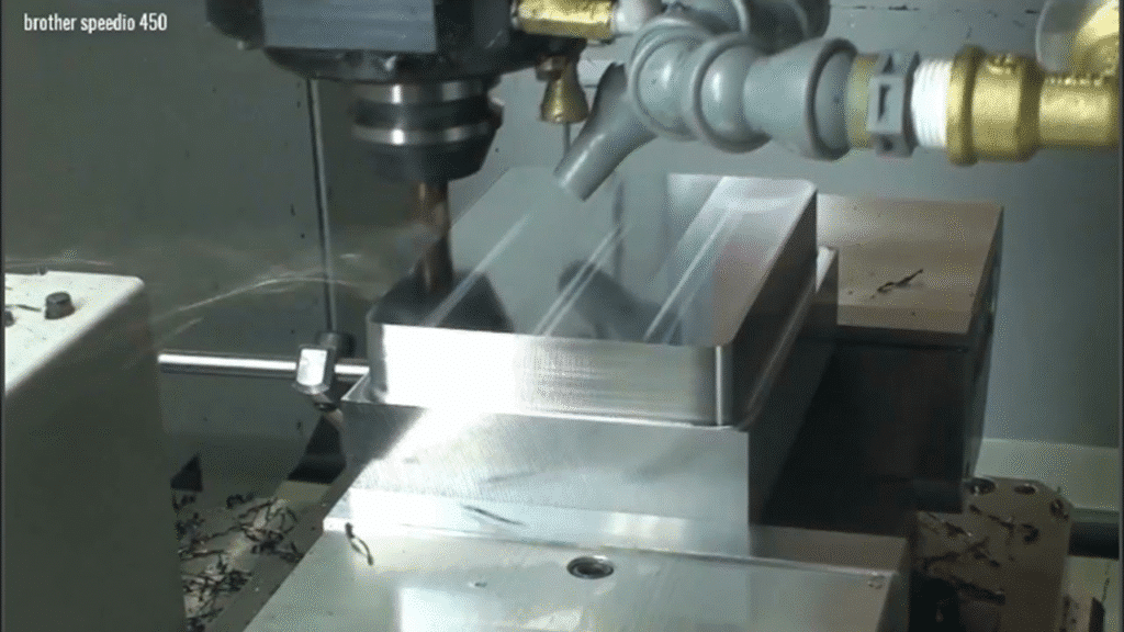 CNC milling aluminum component in mass production showing process control and precision machining stability